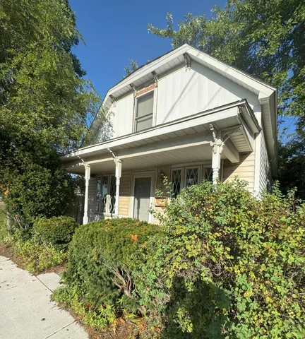 front view of a house with a small yard