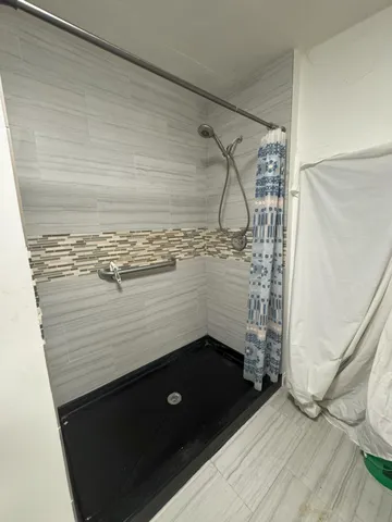 a bathroom with a sink and a shower