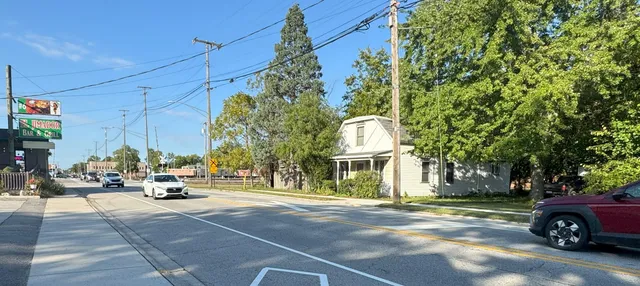a view of a street with cars