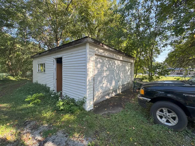 a view of a house with a back yard