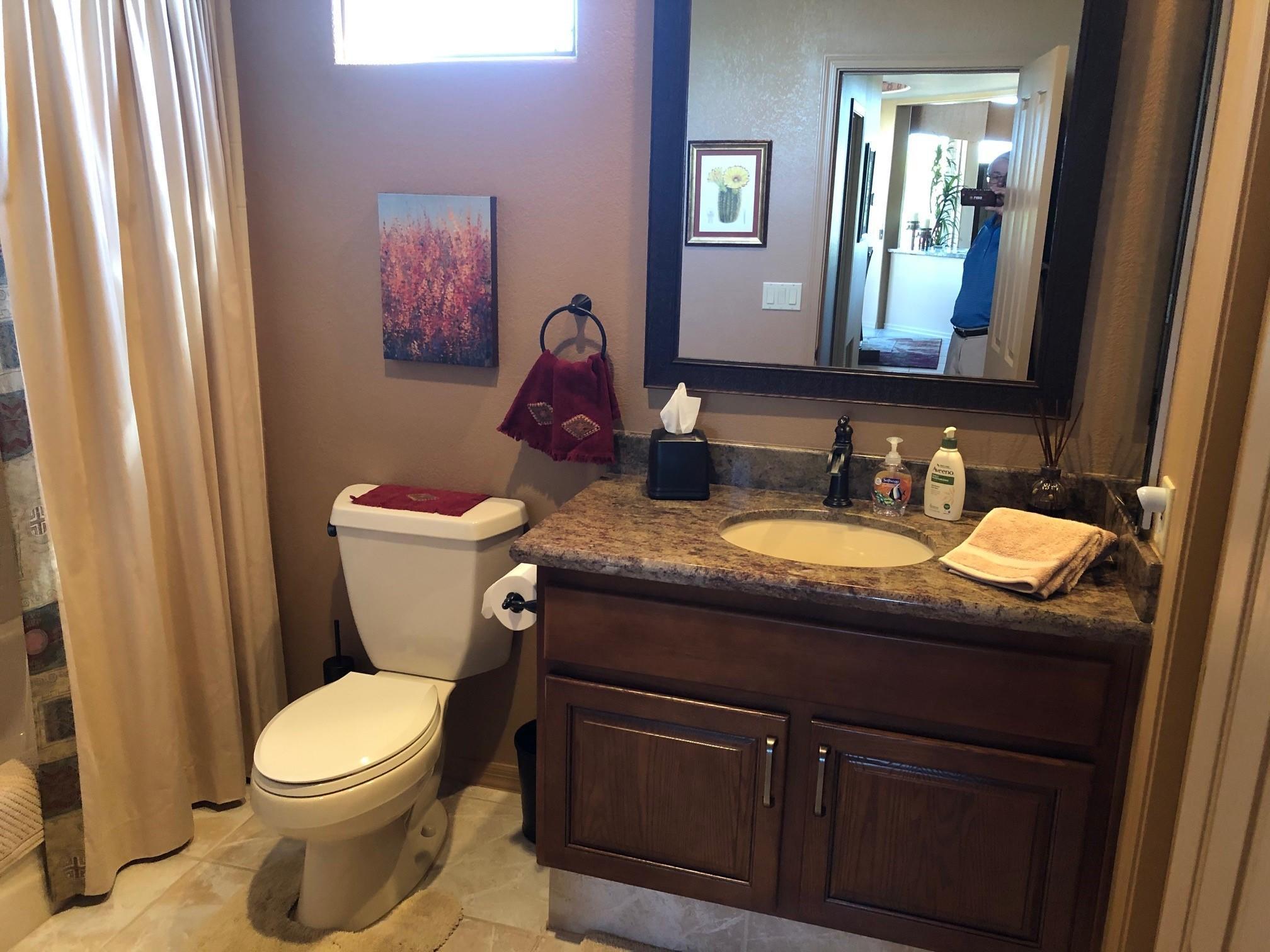 18502 East Picacho Road Rio Verde, AZ 85263 - Photo 11 of 15 a bathroom with a granite countertop toilet sink and mirror