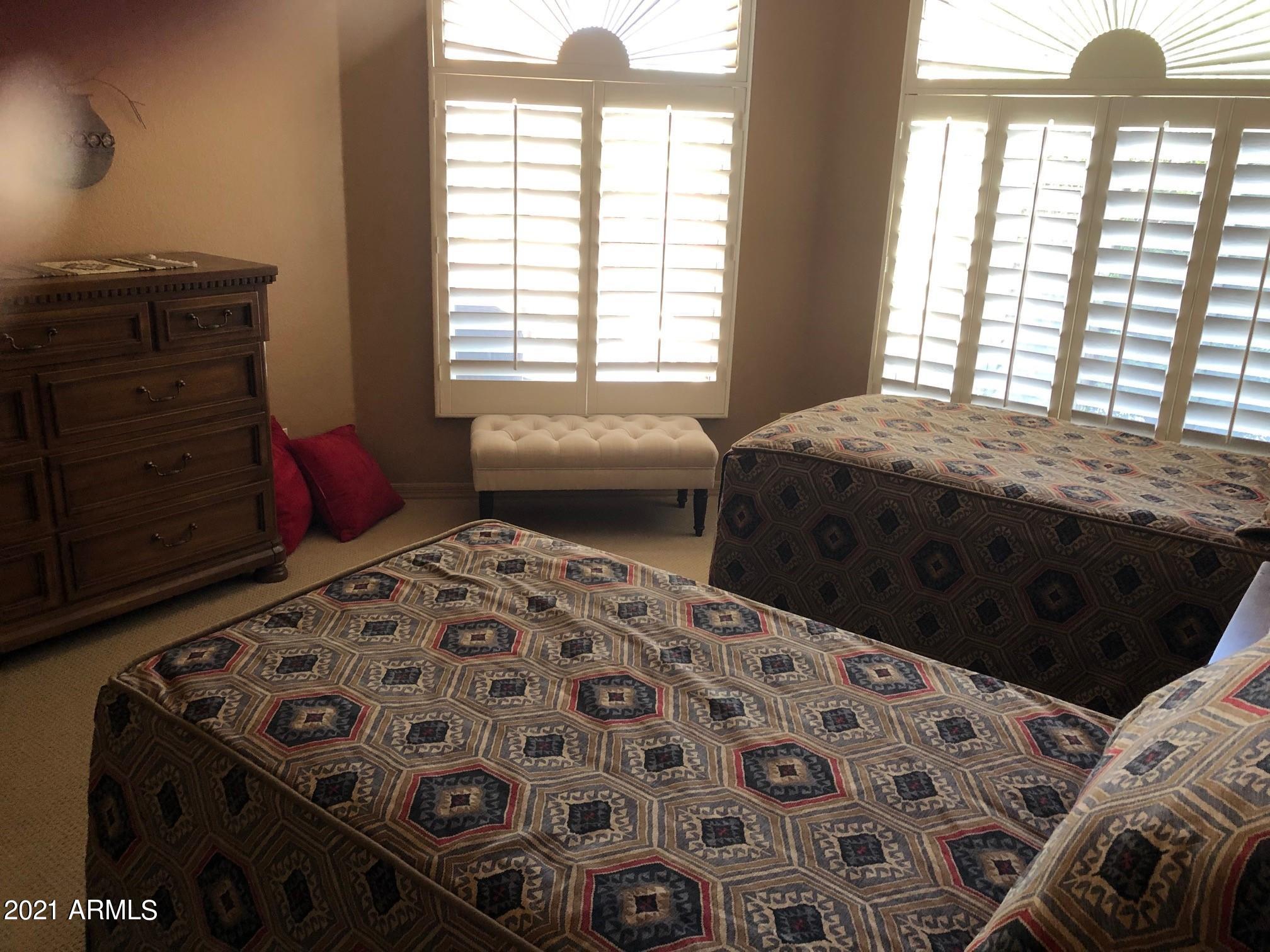 18502 East Picacho Road Rio Verde, AZ 85263 - Photo 12 of 15 a bedroom with a bed and a window