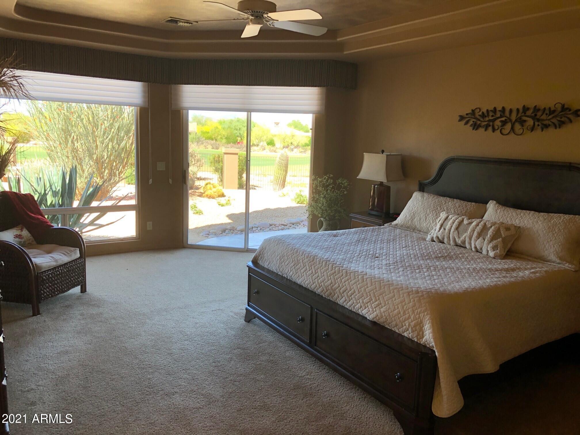 18502 East Picacho Road Rio Verde, AZ 85263 - Photo 14 of 15 a bedroom with a bed and a couch