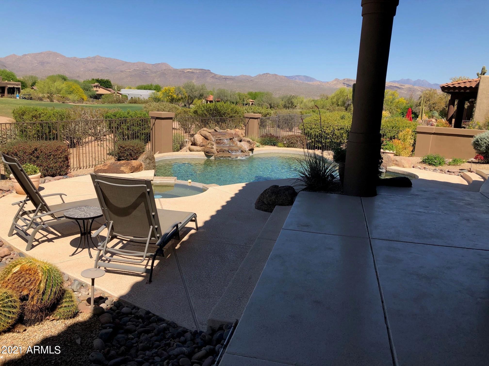 18502 East Picacho Road Rio Verde, AZ 85263 - Photo 3 of 15 a view of a terrace with a table and chairs