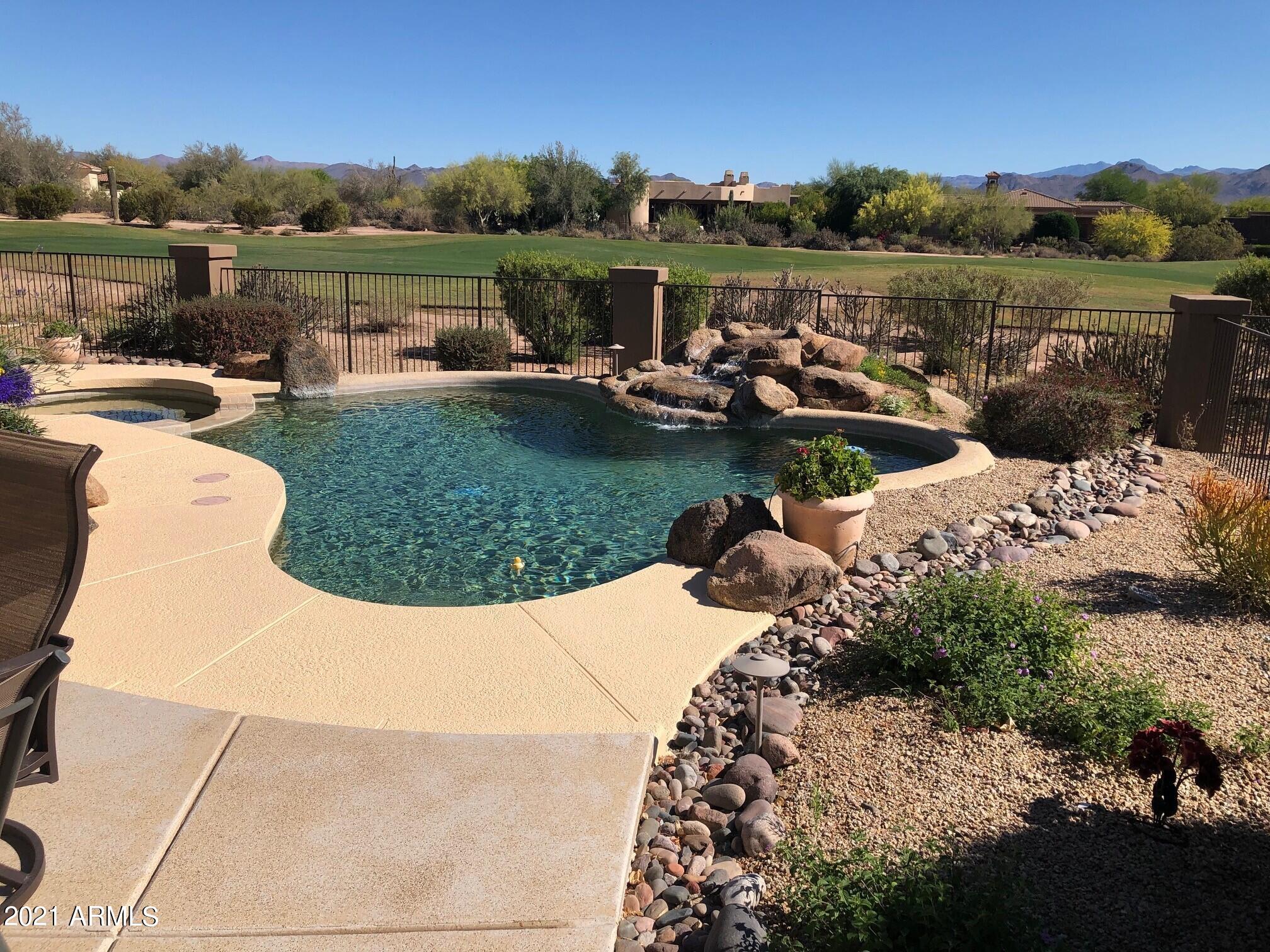 18502 East Picacho Road Rio Verde, AZ 85263 - Photo 4 of 15 a view of a lake with houses