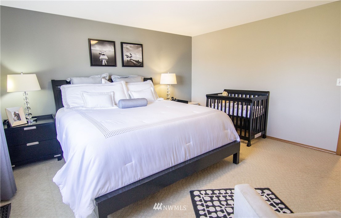 2311 Cedar Road Lake Stevens, WA 98258 - Photo 20 of 37 a bedroom with a bed and a lamp with table