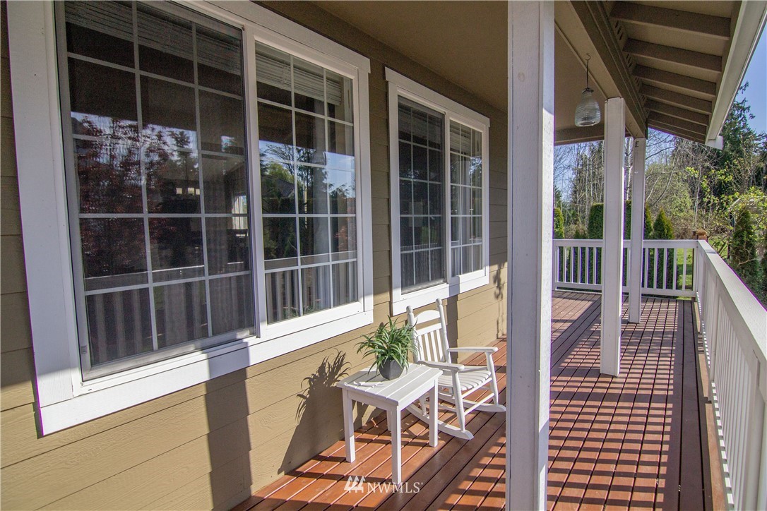 2311 Cedar Road Lake Stevens, WA 98258 - Photo 3 of 37 a view of a balcony with chair and floor to ceiling window