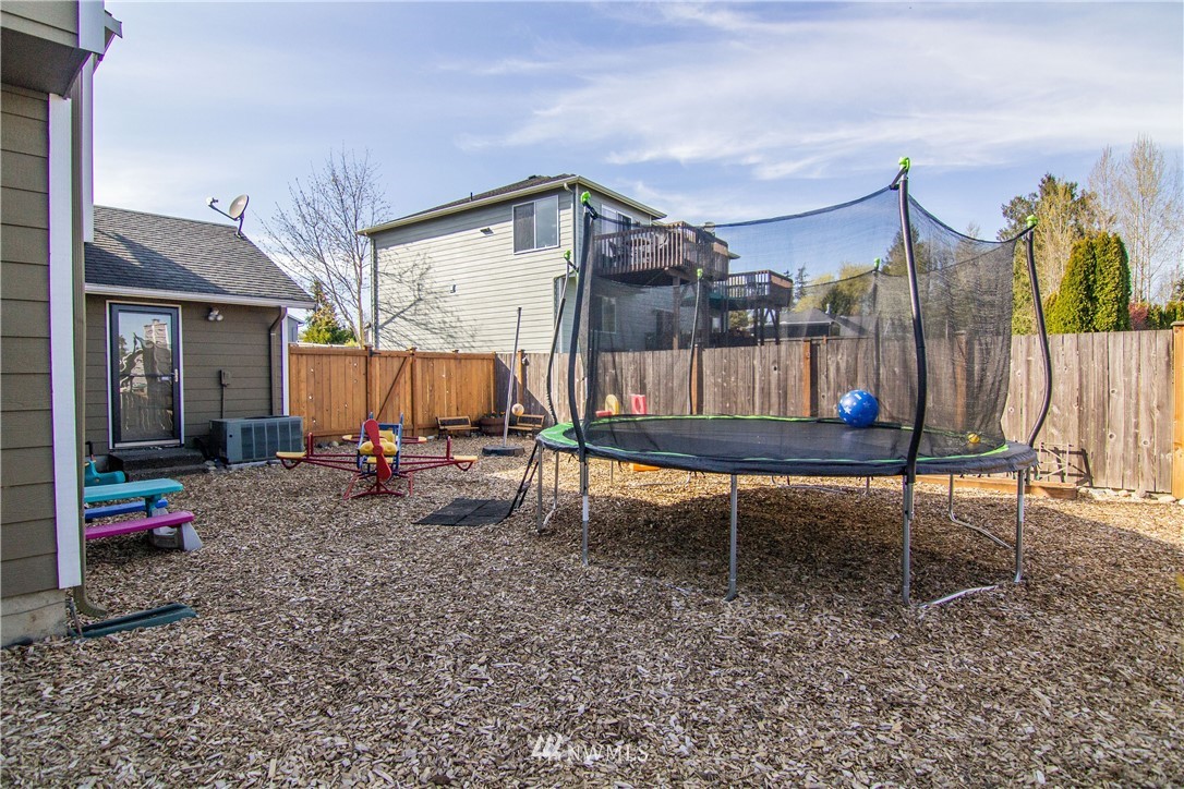 2311 Cedar Road Lake Stevens, WA 98258 - Photo 29 of 37 a backyard of a house with table and chairs