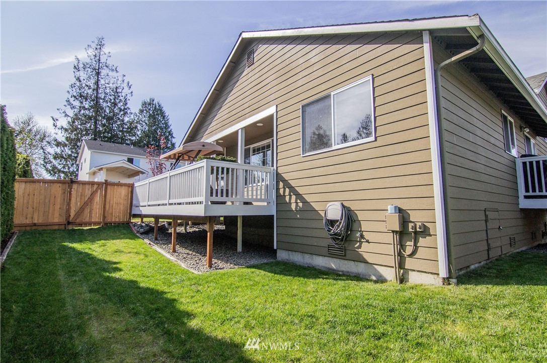 2311 Cedar Road Lake Stevens, WA 98258 - Photo 31 of 37 a backyard of a house with wooden deck and furniture
