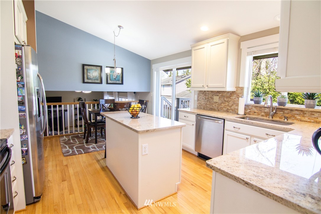 2311 Cedar Road Lake Stevens, WA 98258 - Photo 7 of 37 a kitchen with a refrigerator a stove and a sink