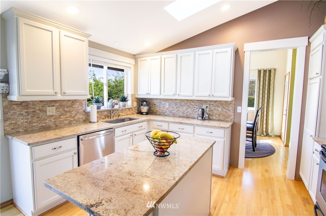 2311 Cedar Road Lake Stevens, WA 98258 - Photo 9 of 37 a kitchen with stainless steel appliances granite countertop a sink stove and cabinets