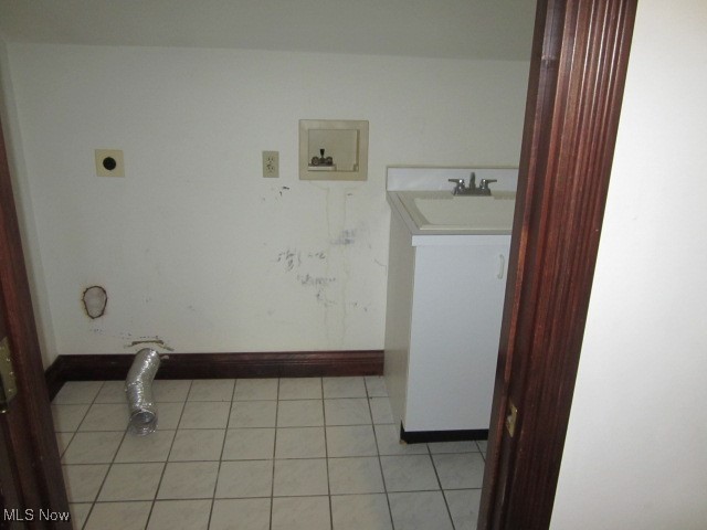 6999 Gates Road Gates Mills, OH 44040 - Photo 8 of 20 Washroom with light tile patterned floors and hookup for a washing machine