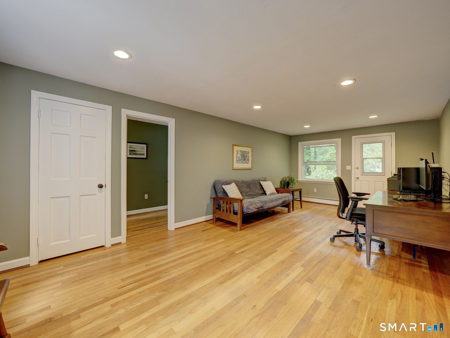 39 Woodhaven Road Glastonbury, CT 06033 - Photo 15 of 40 Living area leading to bedroom. Separate entrance at the far end.