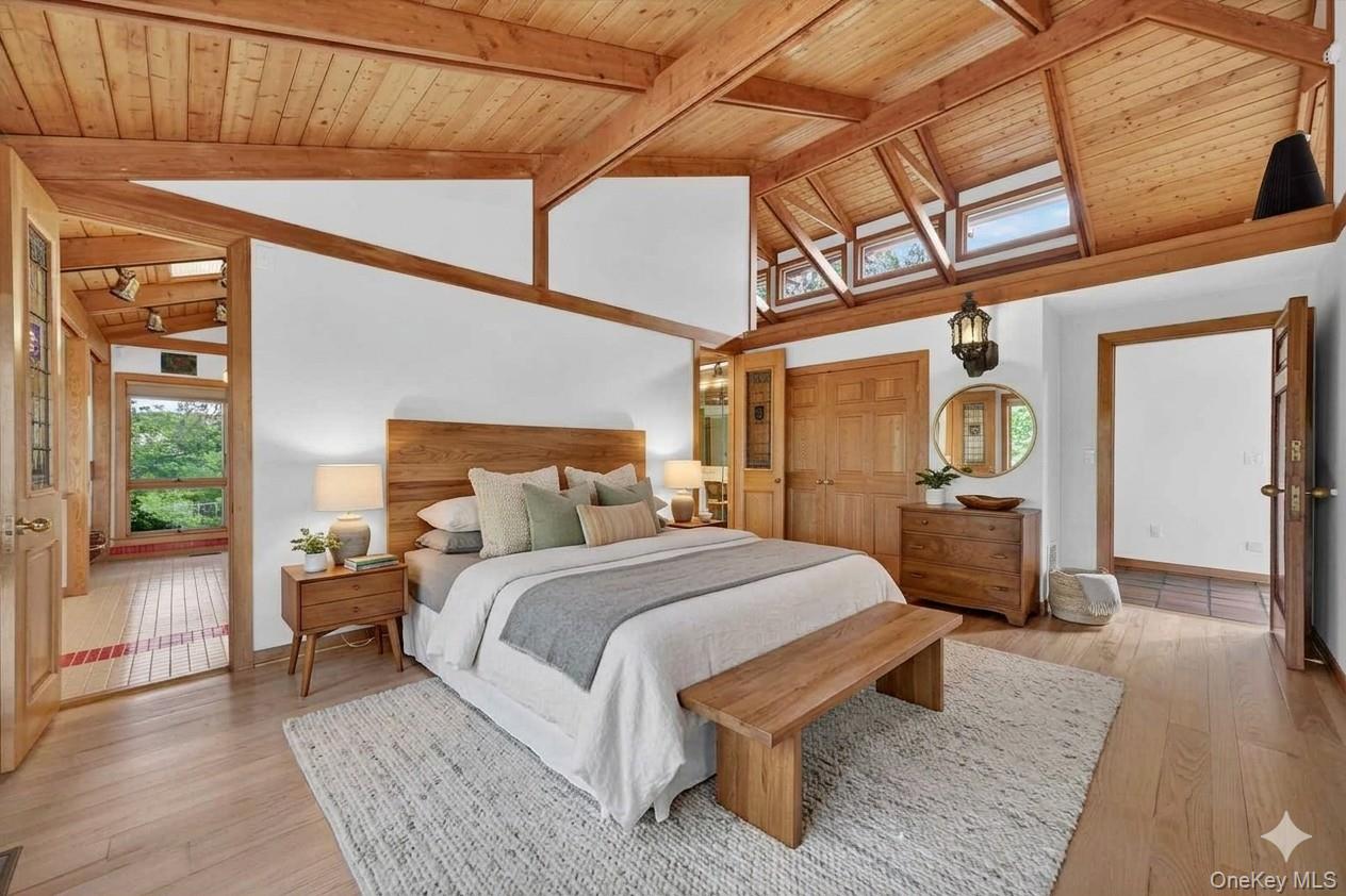 165 Hasbrouck Road Goshen, NY 10924 - Photo 25 of 50 The primary suite is conveniently located on the main level and features a cool open ceiling with wood beams and gleaming floors*virtually staged*