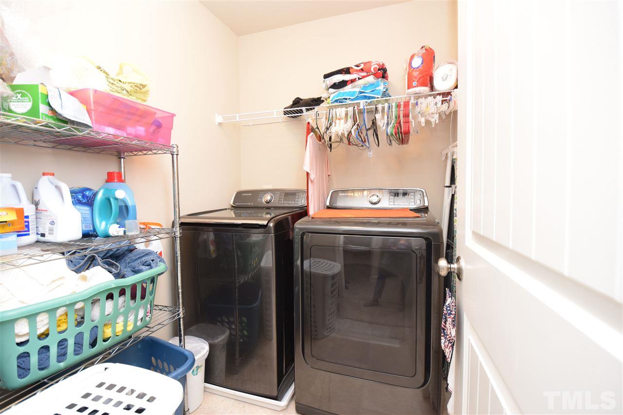 582 Roberts Road Willow Spring, NC 27592 - Photo 13 of 17 a utility room with washer and dryer