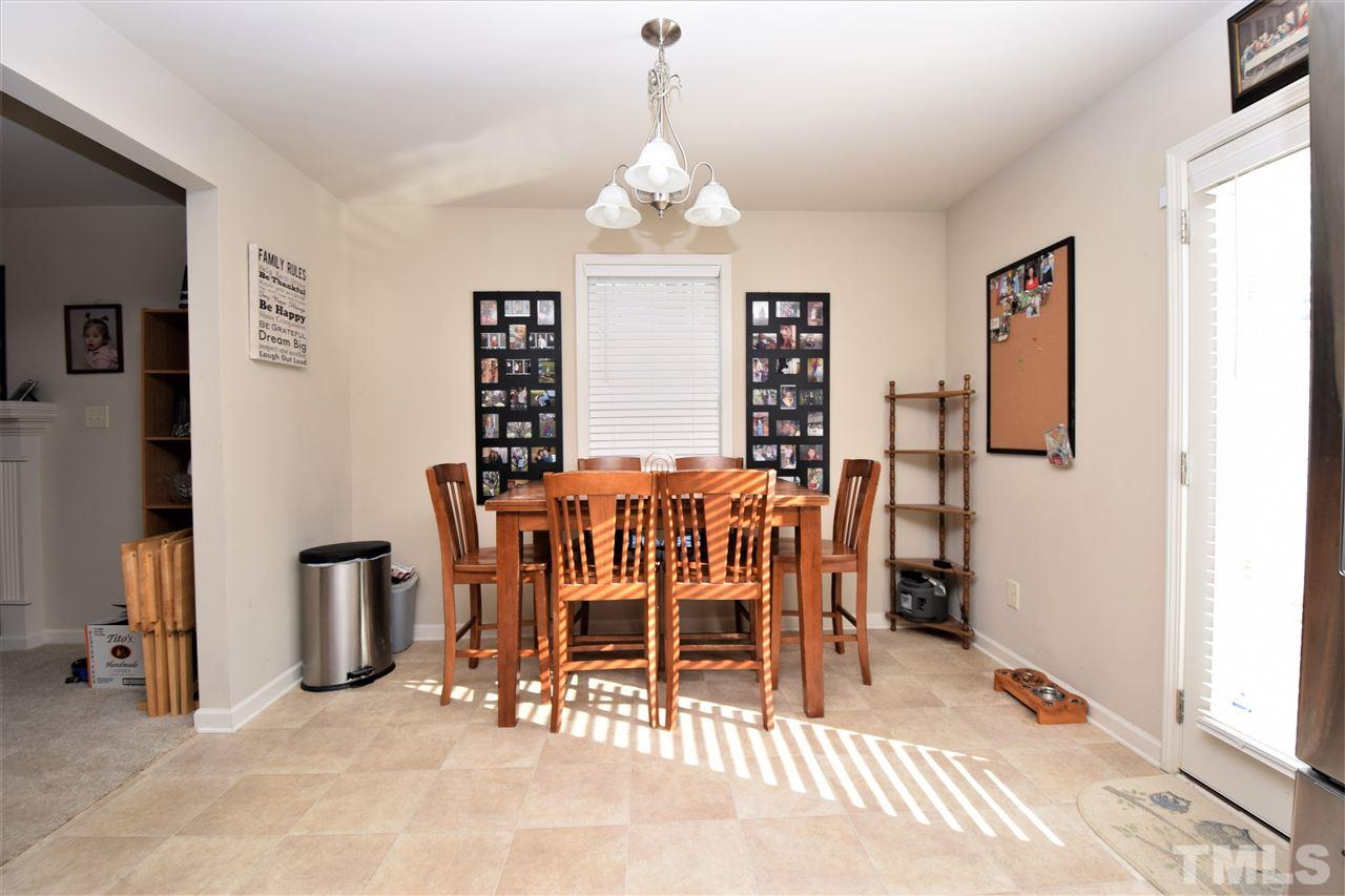 582 Roberts Road Willow Spring, NC 27592 - Photo 9 of 17 a dining room with furniture and window