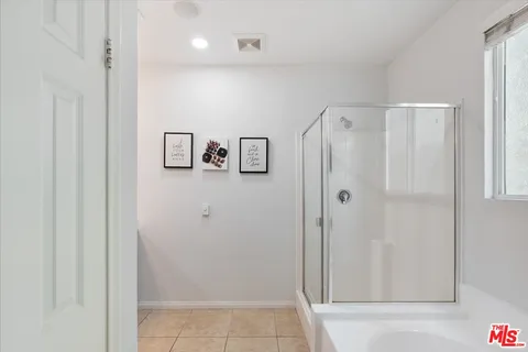 a bathroom with a sink double vanity and a mirror