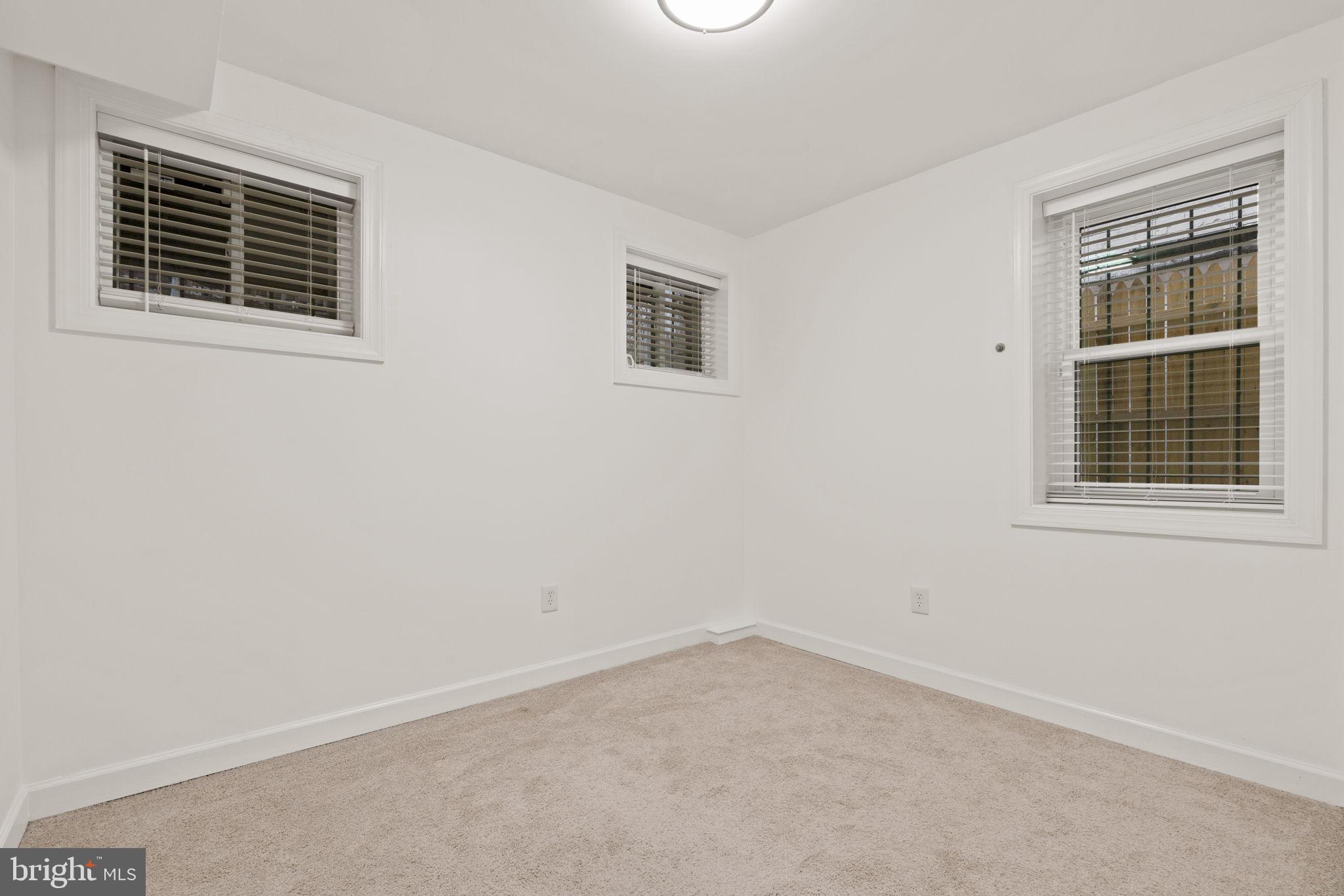 1308 Park Road Northwest, Unit 2 Washington, DC 20010 - Photo 8 of 17 an empty room with a window