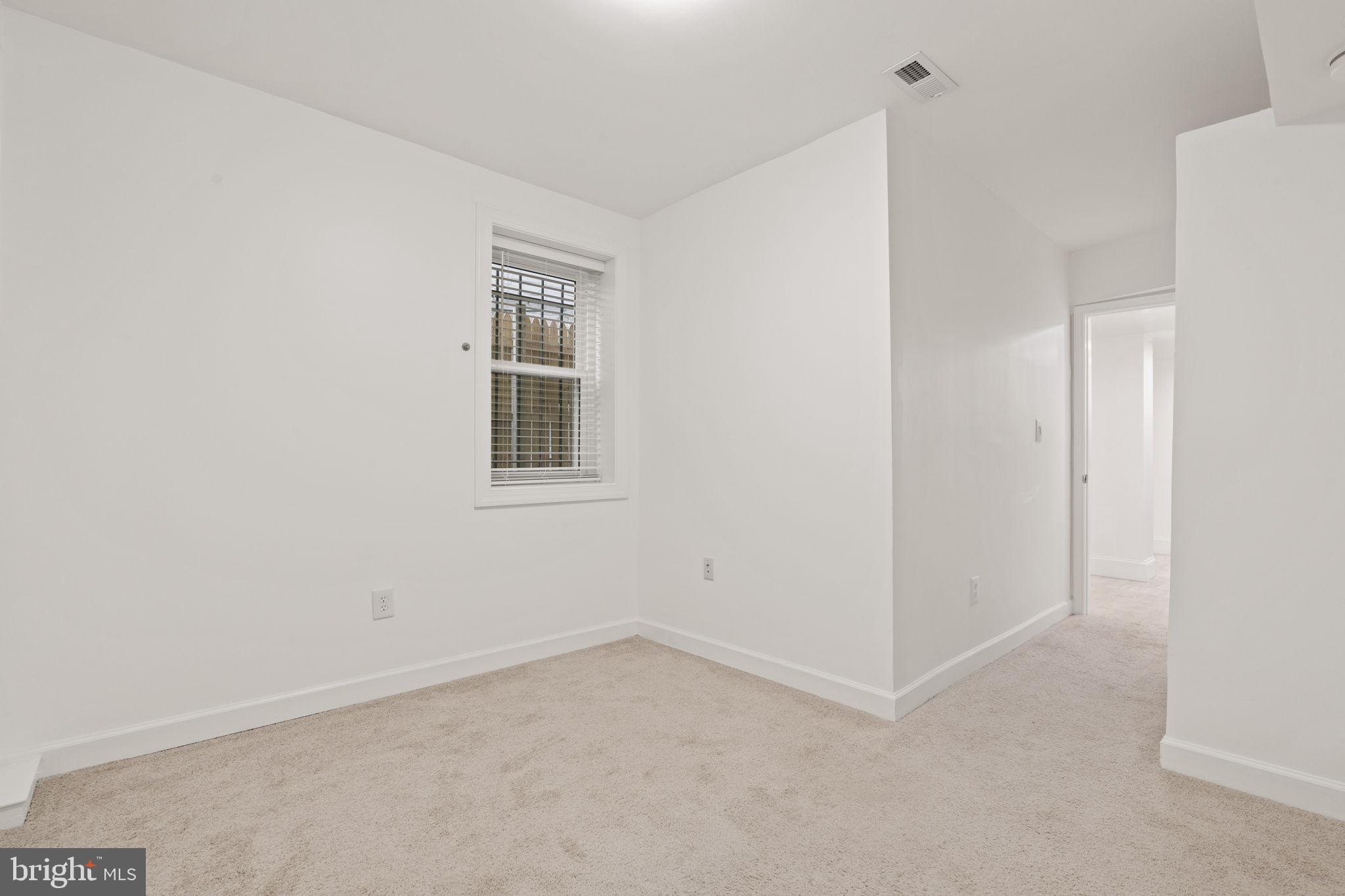 1308 Park Road Northwest, Unit 2 Washington, DC 20010 - Photo 9 of 17 a view of an empty room with a window
