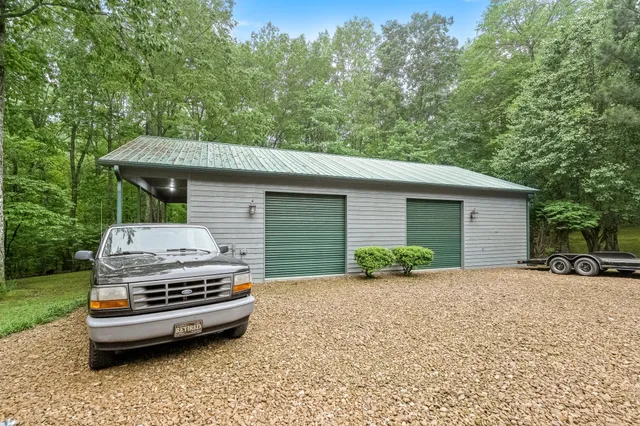 a view of a house with a backyard