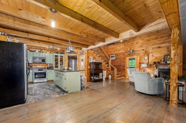 a view of an entryway with wooden floor
