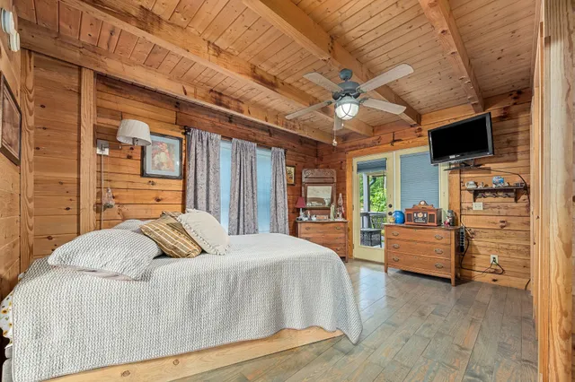 a bathroom with a sink mirror vanity and toilet