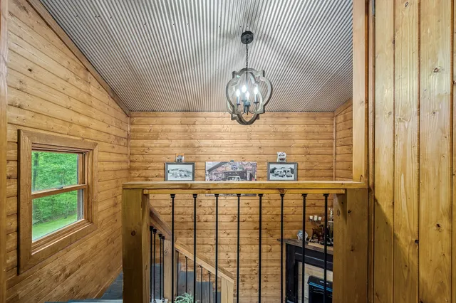 a work room with furniture and floor to ceiling window