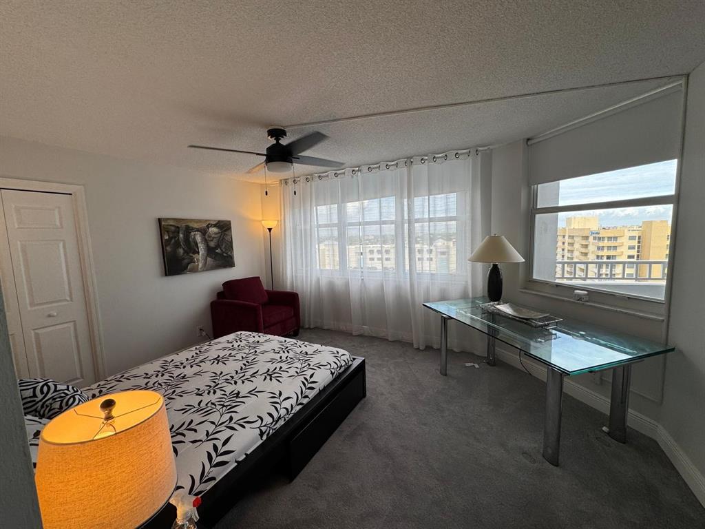 1340 South Ocean Boulevard, Unit 1109 Pompano Beach, FL 33062 - Photo 17 of 42 a living room with a bed furniture and a window