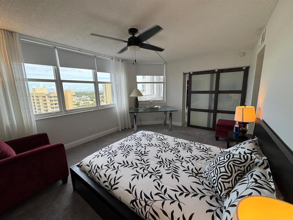 1340 South Ocean Boulevard, Unit 1109 Pompano Beach, FL 33062 - Photo 19 of 42 a bedroom with a bed and window
