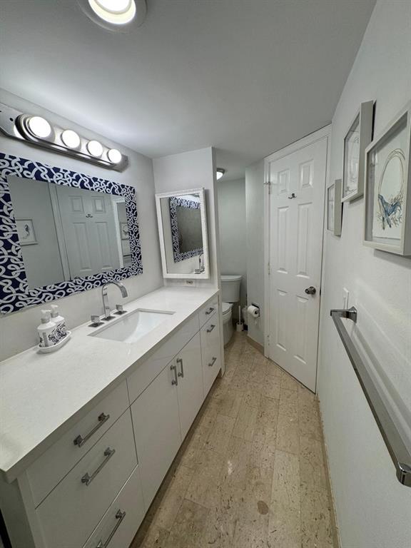 1340 South Ocean Boulevard, Unit 1109 Pompano Beach, FL 33062 - Photo 21 of 42 a spacious bathroom with a double vanity sink mirror and bathtub