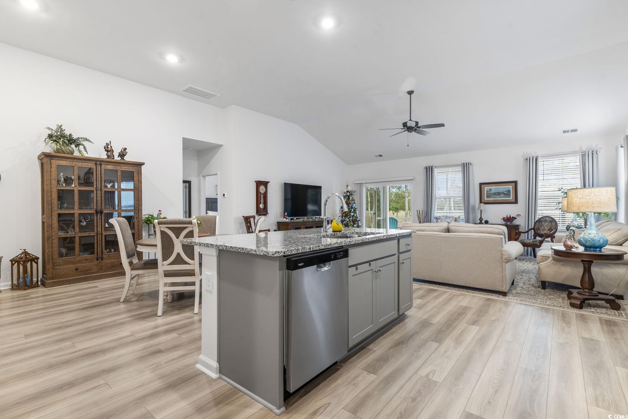 394 Sun Colony Boulevard Longs, SC 29568 - Photo 13 of 40 Showcases the efficient kitchen layout with clear flow to dining and living spaces