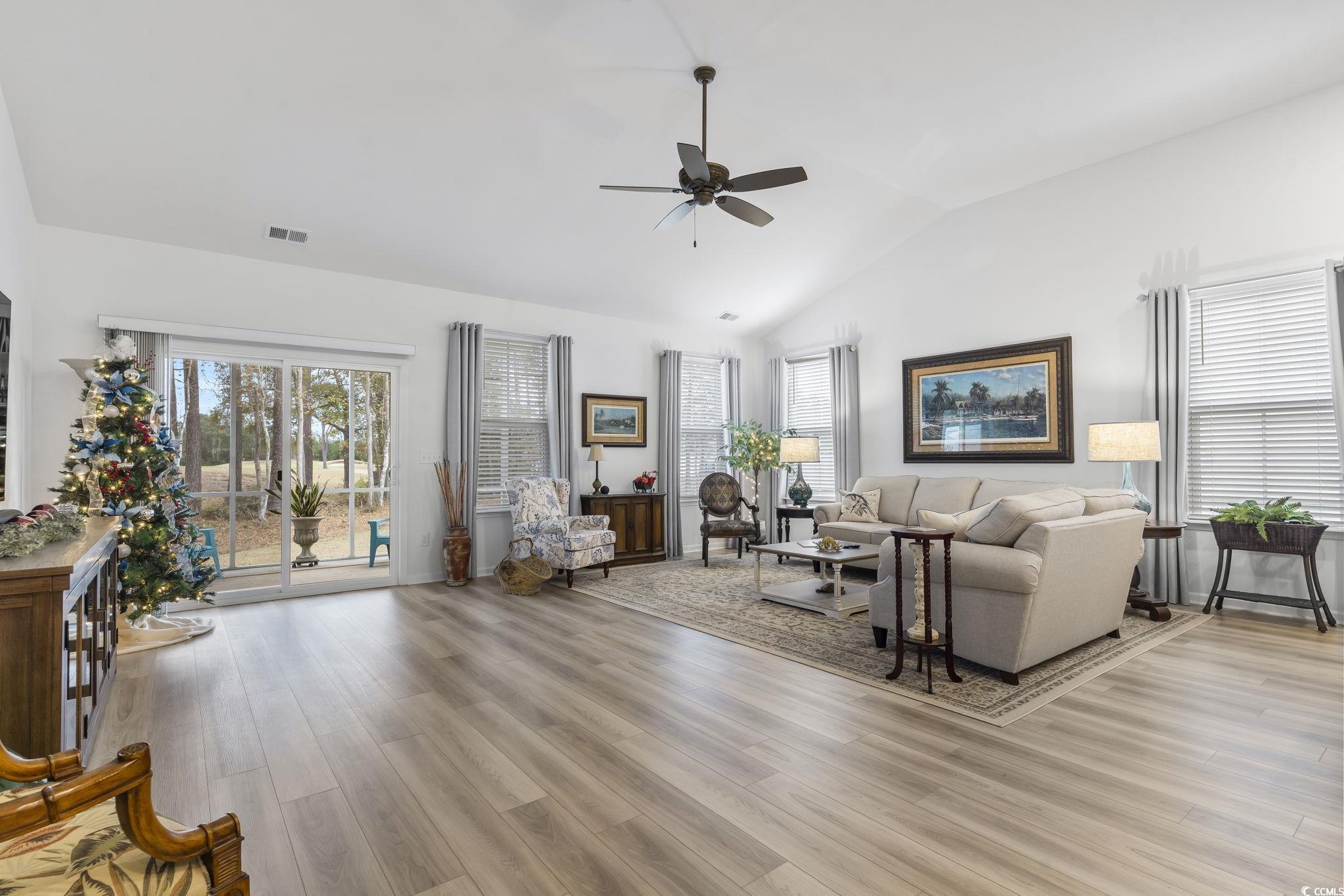 394 Sun Colony Boulevard Longs, SC 29568 - Photo 16 of 40 Open-concept living space with upgraded ceiling fan, vaulted ceilings and enhanced natural light