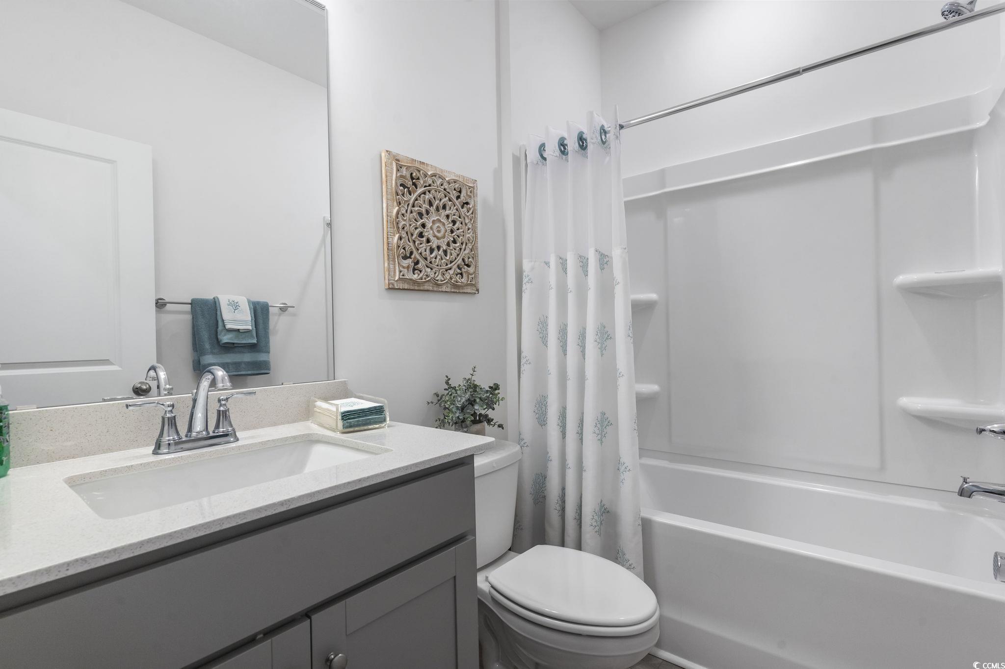 394 Sun Colony Boulevard Longs, SC 29568 - Photo 25 of 40 Full guest bath with vanity and tub/shower combination.