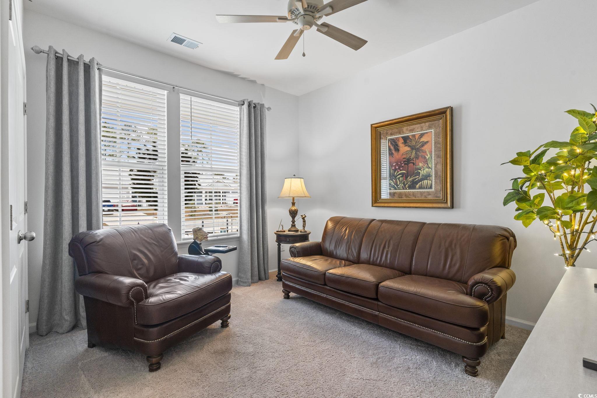394 Sun Colony Boulevard Longs, SC 29568 - Photo 26 of 40 Guest bedroom utilized as a flex space, ideal for a sitting room, office, or reading area.