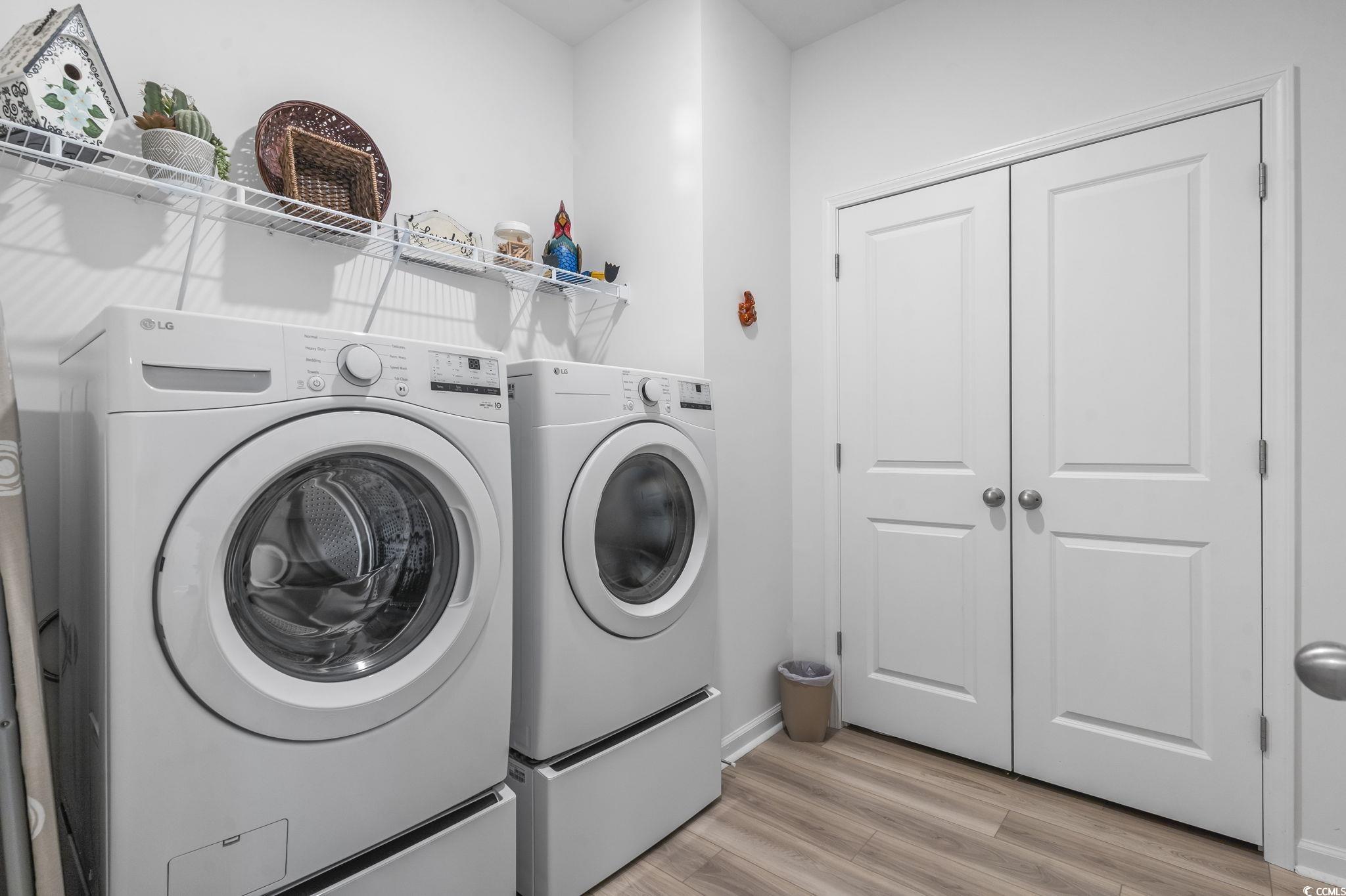 394 Sun Colony Boulevard Longs, SC 29568 - Photo 27 of 40 Dedicated laundry area with shelving and easy access to main living space.