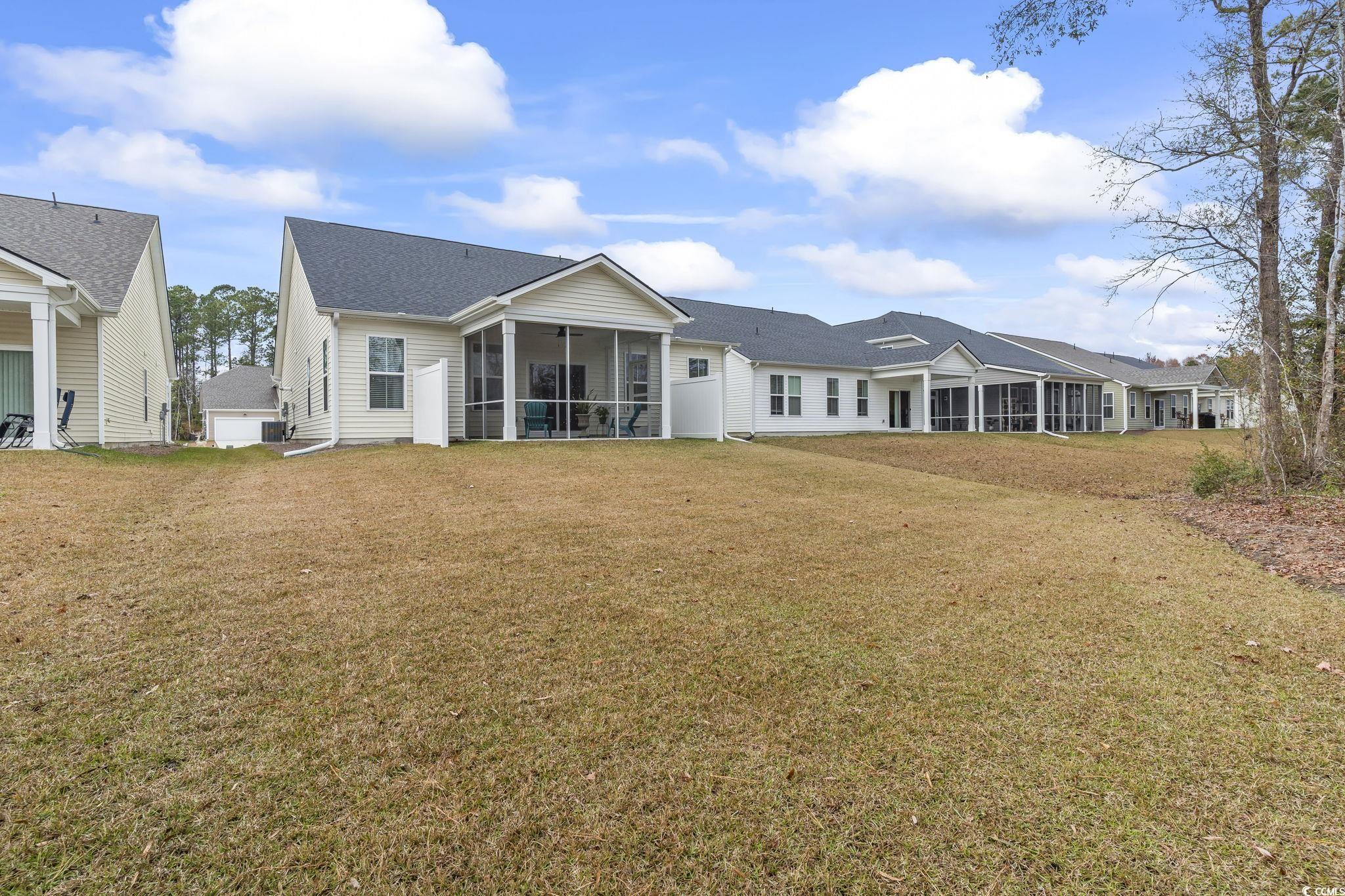 394 Sun Colony Boulevard Longs, SC 29568 - Photo 32 of 40 Beautiful view of well maintained back yard and exterior of home
