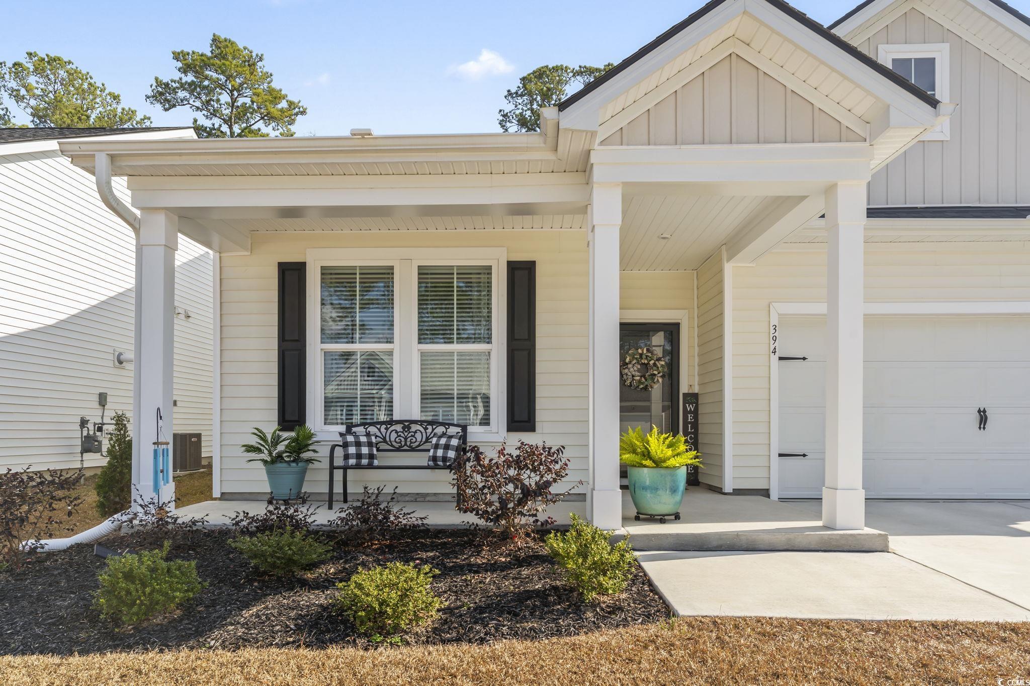 394 Sun Colony Boulevard Longs, SC 29568 - Photo 34 of 37 Beautiful curb appeal with upgraded Chelsea elevation and extended front porch overhang.