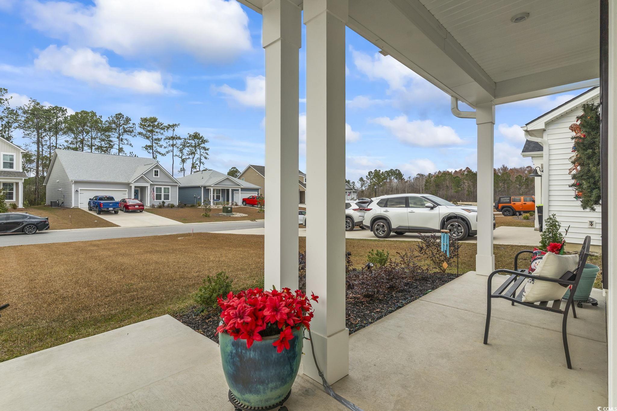 394 Sun Colony Boulevard Longs, SC 29568 - Photo 37 of 40 Enjoy the neighborhood while sitting on the front porch