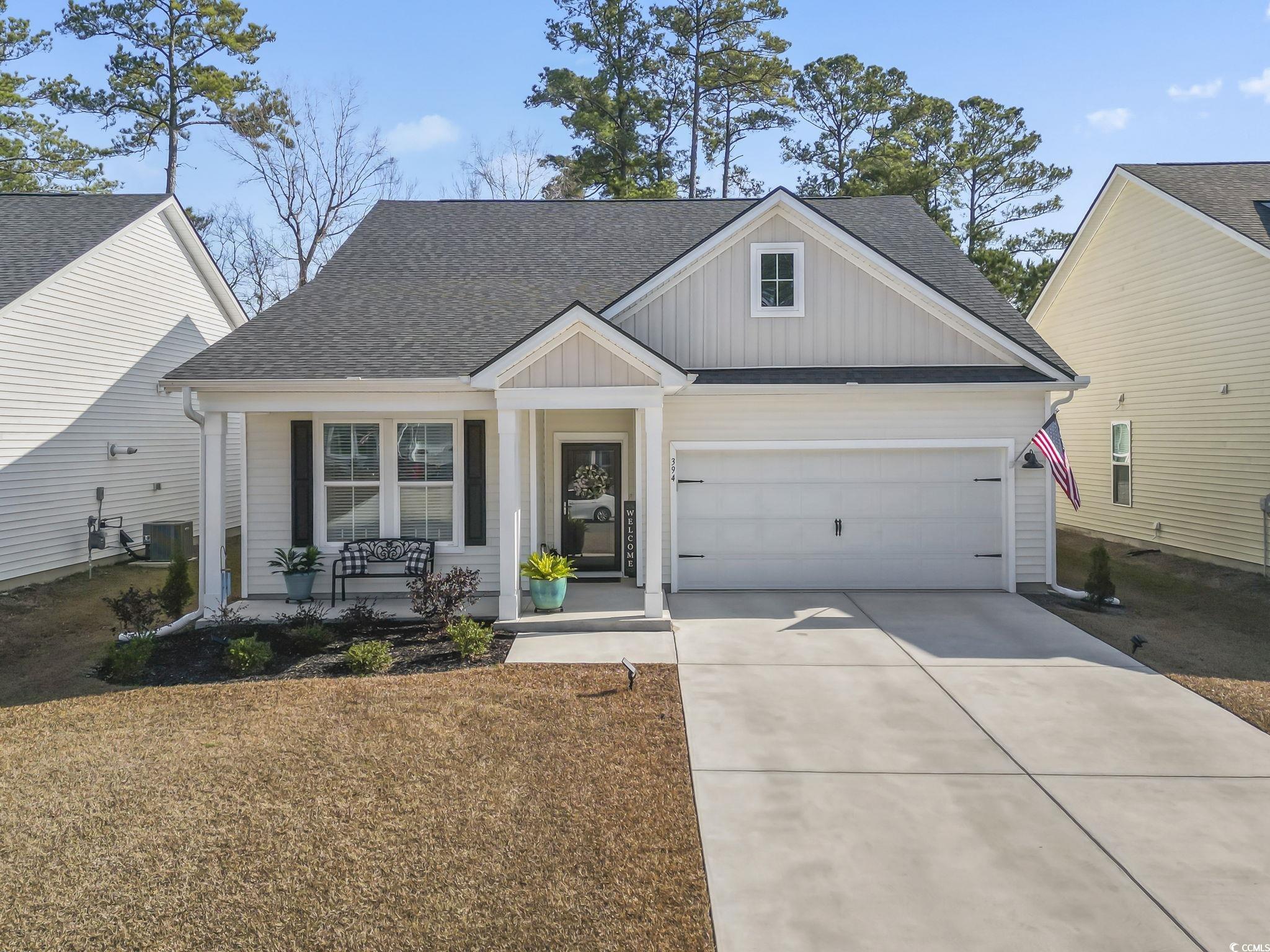 394 Sun Colony Boulevard Longs, SC 29568 - Photo 4 of 37 Beautiful curb appeal with upgraded Chelsea elevation and extended front porch overhang