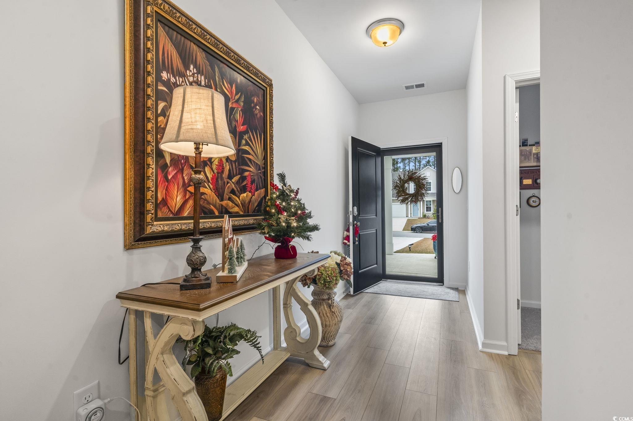 394 Sun Colony Boulevard Longs, SC 29568 - Photo 5 of 40 Welcoming entryway with natural light and direct access to main living areas.