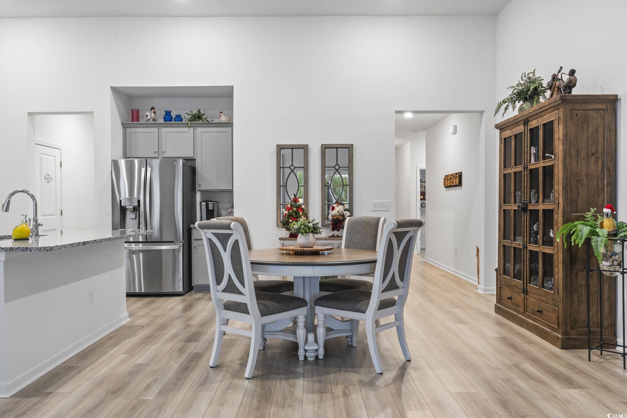394 Sun Colony Boulevard Longs, SC 29568 - Photo 7 of 40 Showcases the dining area with the open concept