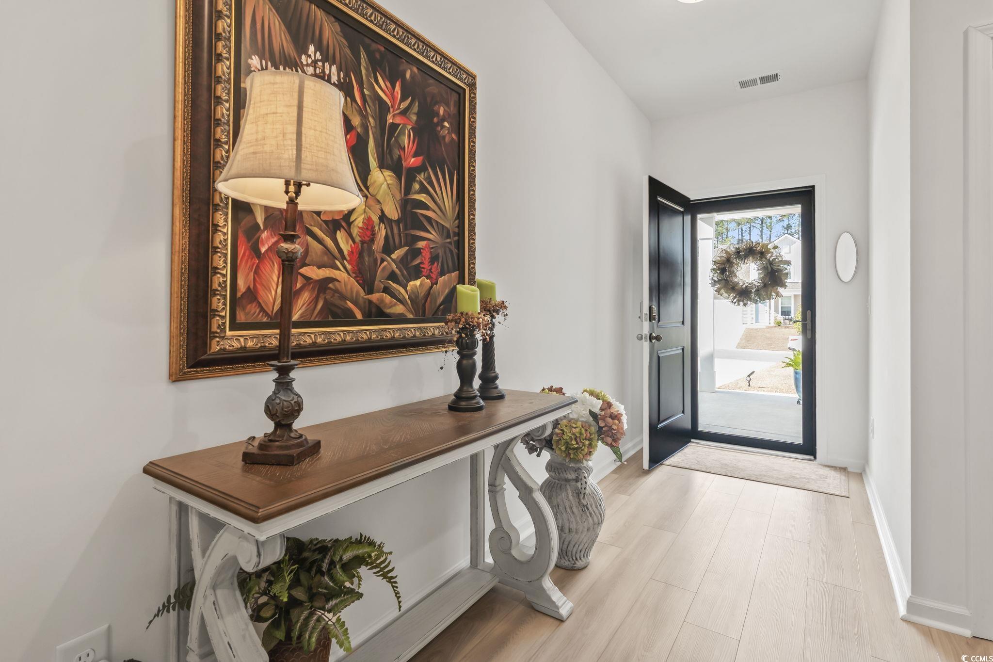 394 Sun Colony Boulevard Longs, SC 29568 - Photo 8 of 37 Welcoming entryway with natural light and direct access to main living areas.