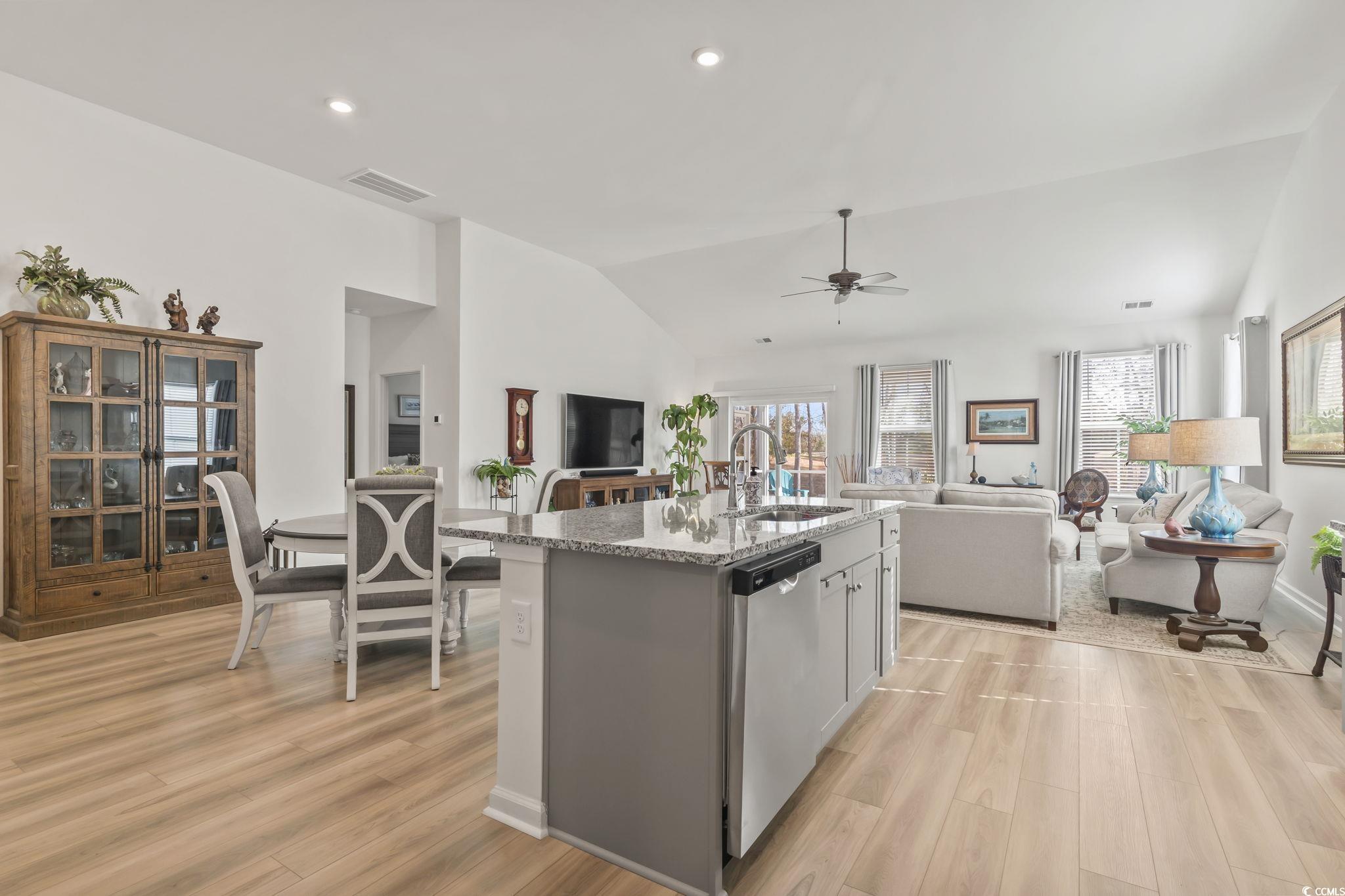 394 Sun Colony Boulevard Longs, SC 29568 - Photo 9 of 37 Dining space adjacent to the kitchen with upgraded lighting and window treatments