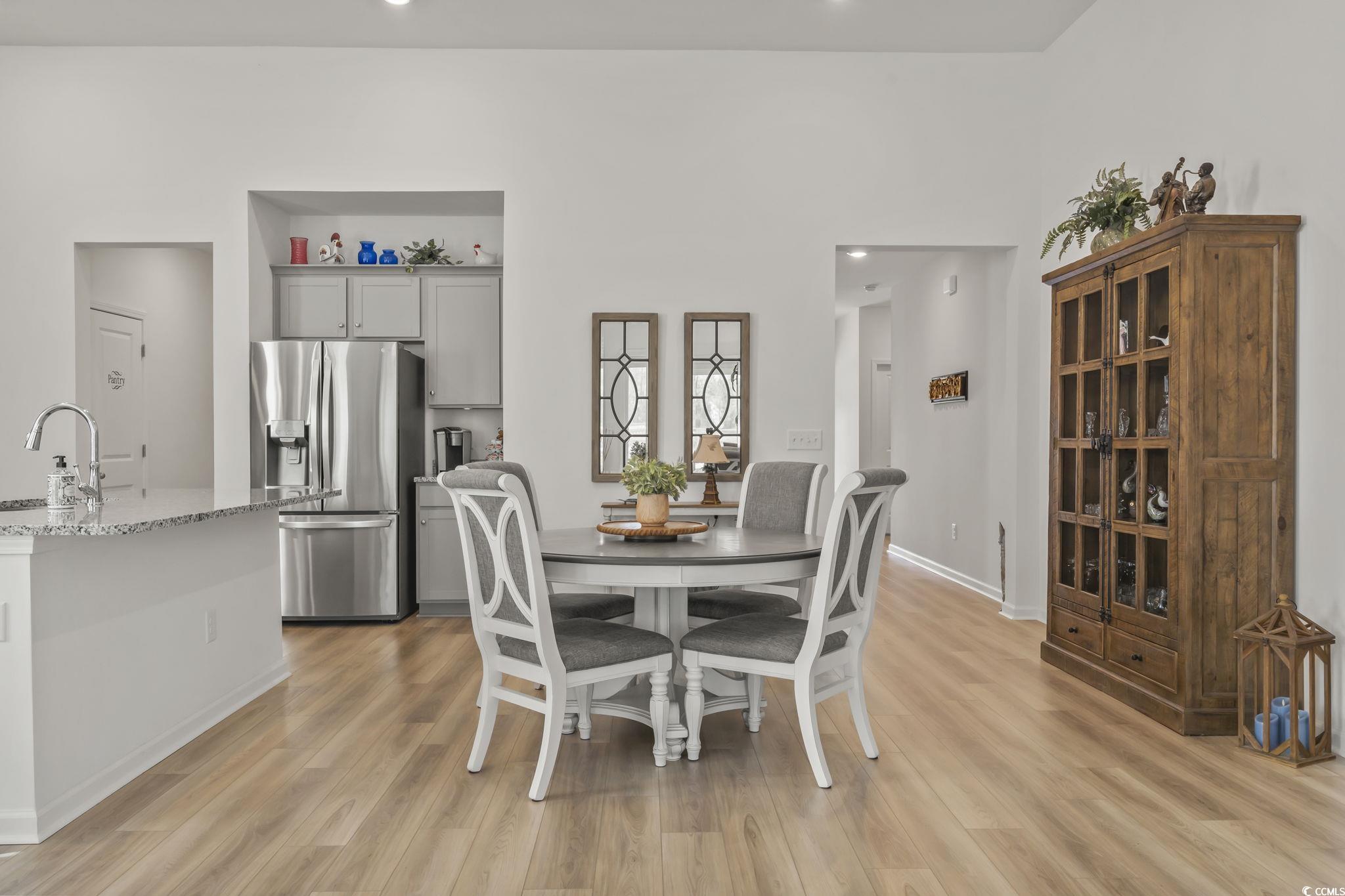 394 Sun Colony Boulevard Longs, SC 29568 - Photo 10 of 37 Showcases the dining area with the open concept