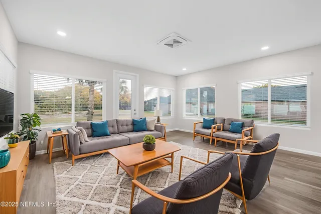 a bedroom with bed and a potted plant