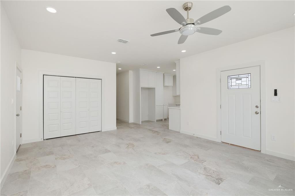321 Merida Drive Donna, TX 78537 - Photo 3 of 11 an empty room with fan and a ceiling fan