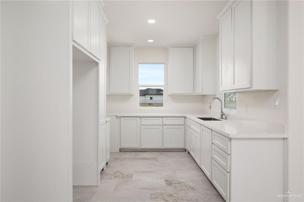 321 Merida Drive Donna, TX 78537 - Photo 4 of 11 a kitchen with a sink cabinets and window