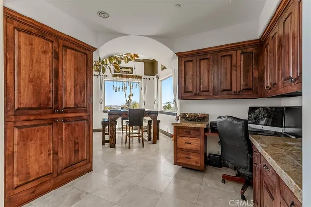 a kitchen with stainless steel appliances granite countertop a stove and a refrigerator