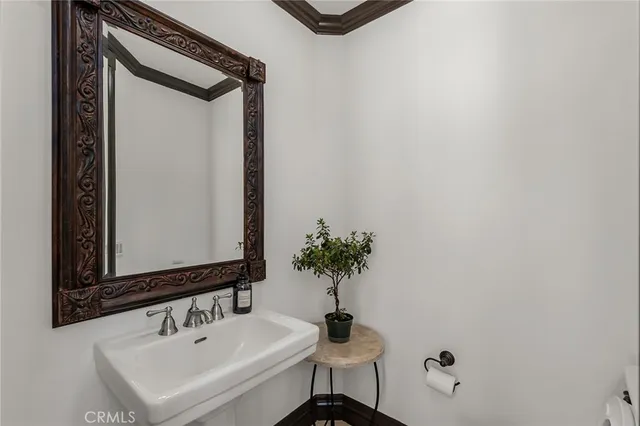 a bedroom with furniture and a flat screen tv