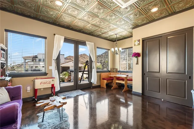 a view of a large building with mountains in the background